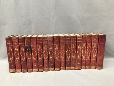 a set of six antique books with red covers on a white background