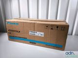 the box is sitting on the table next to the wall