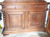 a wooden cabinet with a mirror on top of it
