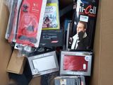 a cardboard box full of electronic devices and other items