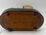 an image of a wooden box with a wooden handle on a white surface