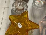 a star shaped glass object on the counter