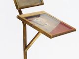 a small desk with a laptop on it