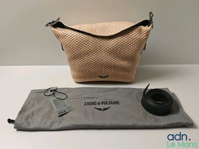 an image of a bag and a belt sitting on a table
