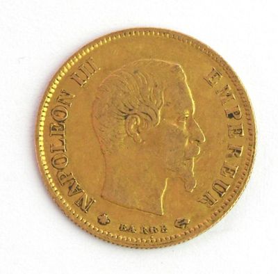 une pièce d'or sur laquelle figure l'image d'un homme