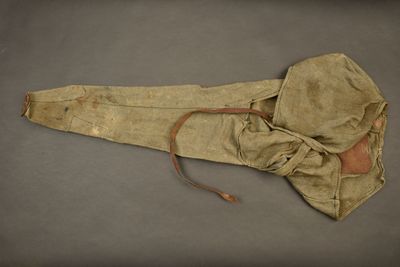 an image of an old leather bag with a hood on it