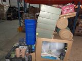a pile of boxes and rolls of toilet paper in a warehouse