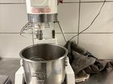 a mixer that is sitting on a counter in a kitchen