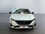 the front view of a white car in a showroom