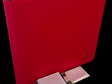 a red binder with a keyboard attached to it