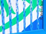 a close up of a toothbrush on a blue shelf