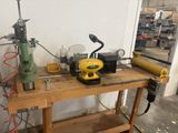 a workbench with a lot of tools on it