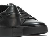 black leather sneakers with a rubber sole and a rubber sole