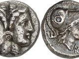 a silver coin with a woman and a man on it