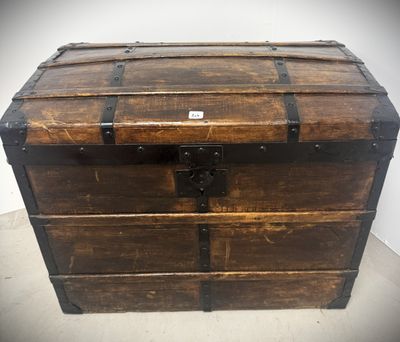 an old wooden chest with a metal latch on top