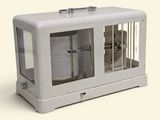 an image of a small cage with a dog inside of it