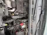 an image of a car engine with its hood open