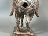 a statue of a horse with a bird on it ' s back