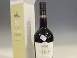 a bottle of wine sitting next to a box of wine