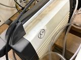 a machine that is sitting on a table with wires attached to it