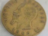 a close up of a gold coin with a woman ' s head on it