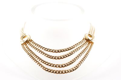 a close up of a necklace on a mannequin mannequin