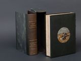 an old book with a picture of a man riding a horse inside of it