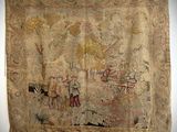 an old tapestry hanging on a wall in a room