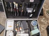 a suitcase full of tools sitting on the floor