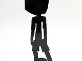 statue of a man with a hat on his head on a black base