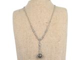 a close up of a necklace on a mannequin mannequin