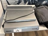 a laptop computer sitting on top of a shelf in front of a wall