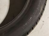 a close up of a tire on a white surface