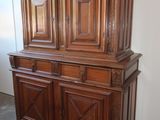 an image of a wooden china cabinet in a room