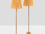 a pair of bamboo lamps on a table with a white background