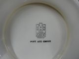 a close up of a plate on a red table cloth