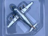 a plastic box with a model of a plane in it