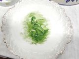 a plate with a picture of a woman on it