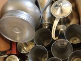 a box full of silver items that are sitting on a table