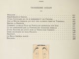 a menu with a drawing of a man ' s face on it