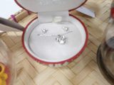 a box with a ring inside of it on a table