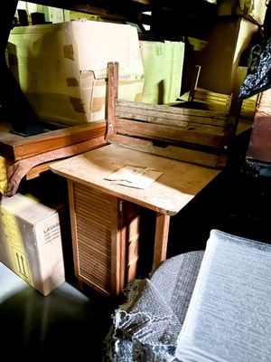 a desk with a chair and a mirror in a room