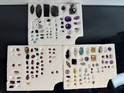 a lot of different types of gems on the table