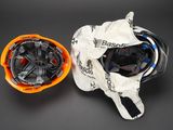 two helmets that are sitting next to each other on a table