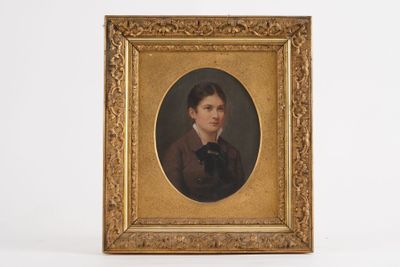 portrait of a young man with a black cat in a gold frame