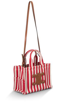 un sac rayé rouge et blanc avec un chien marron dessiné dessus