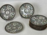 six plates with floral designs are stacked on top of each other
