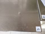 a stainless steel counter top with a number on it