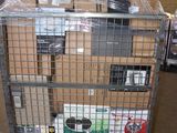 a metal cart with many boxes on it in a warehouse