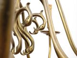 a close up of a brass instrument on a white background